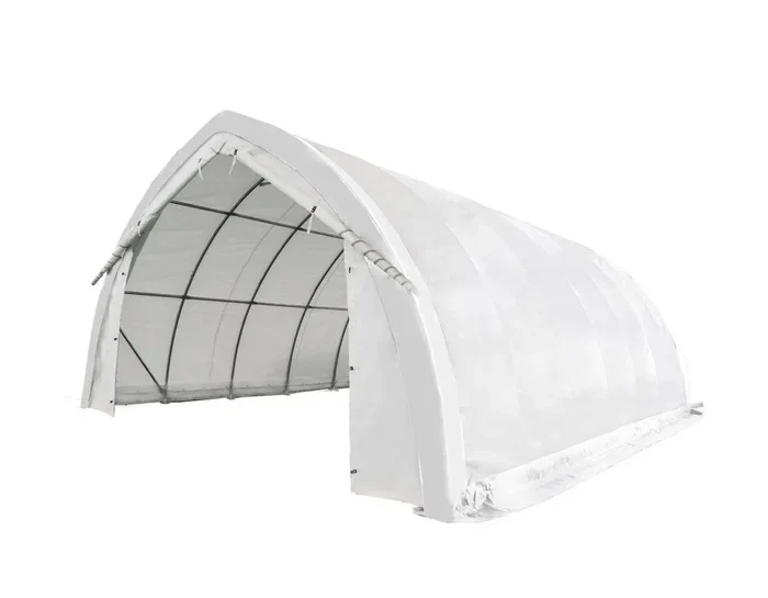 An arch wall shelter carries snow with less steel because the curve never lets the load bend anything. 